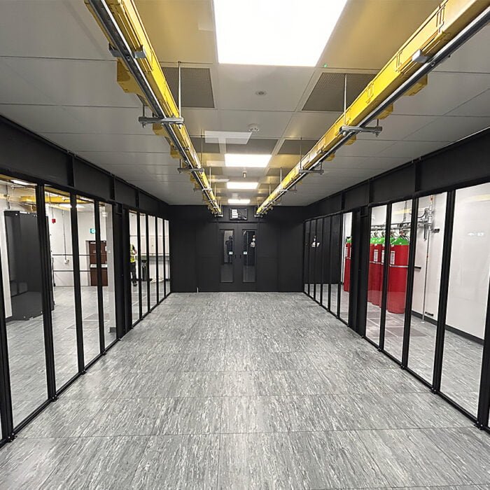 Hot Aisle Containment Aisle awaiting racks with Perspex infill panels